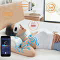 A model lying on a bed in a bedroom using the Bluetooth Music Eye Massager. A small graphic of a smart phone on the bottom left corner depicting music being played via Bluetooth.
