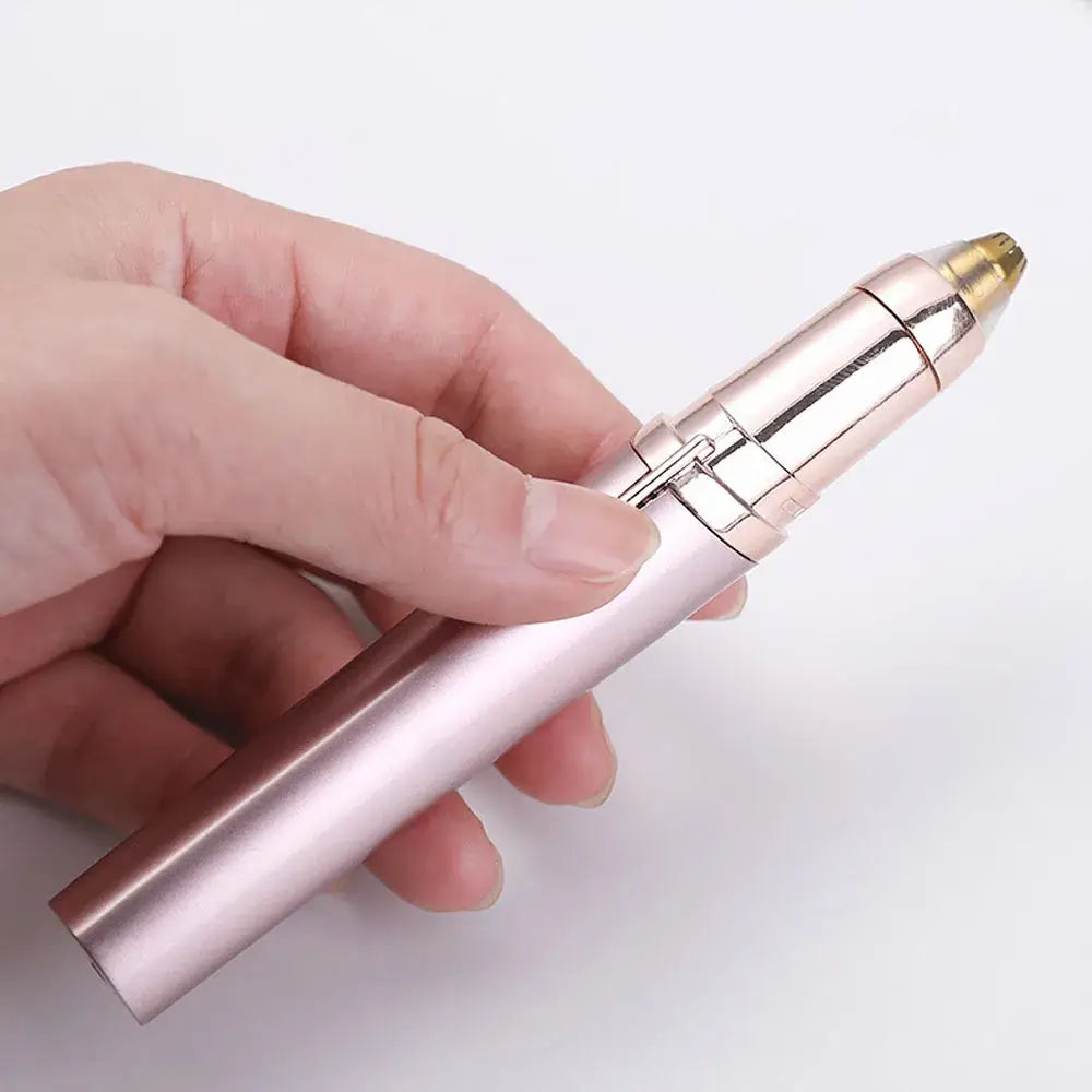 Someone holding the champagne eyebrow epilator